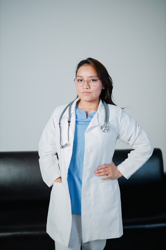 About Portrait of a female doctor in a lab coat with a stethoscope, embodying professionalism and confidence.